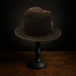 Front view of the ScrewU handmade felt hat in dark brown with distressed texture